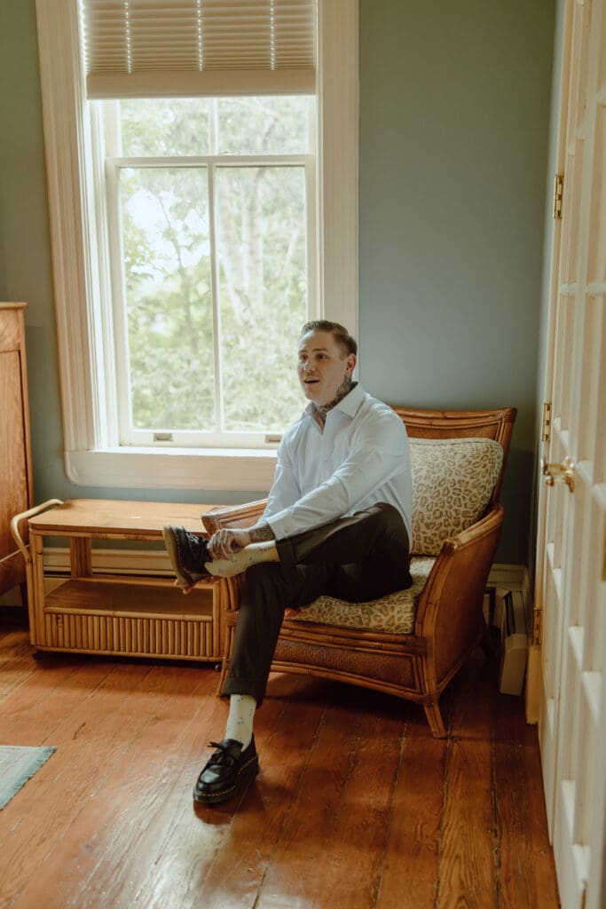 Denver wedding photographer 
Groom putting on his shoes