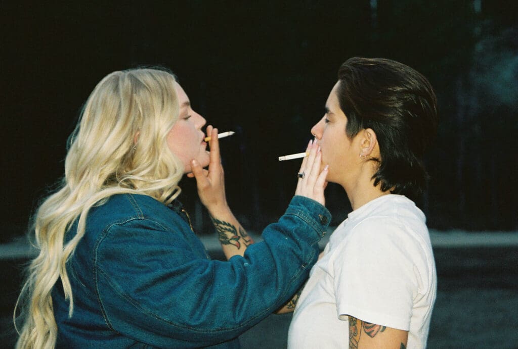 couple smoking a cigarette at their engagement session