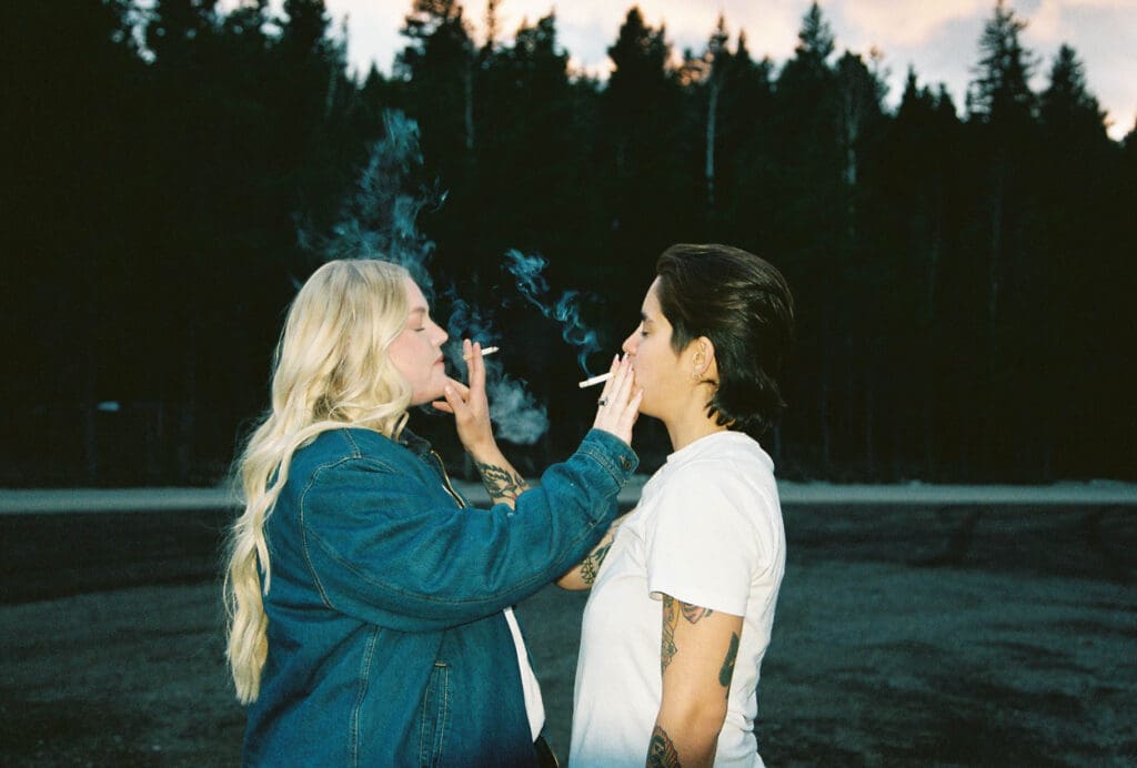 couple smoking a cigarette at their engagement session
