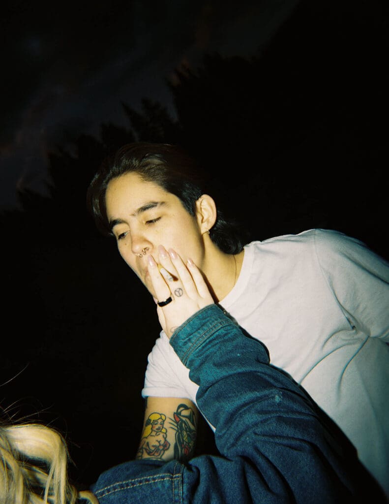 couple smoking a cigarette at their engagement session