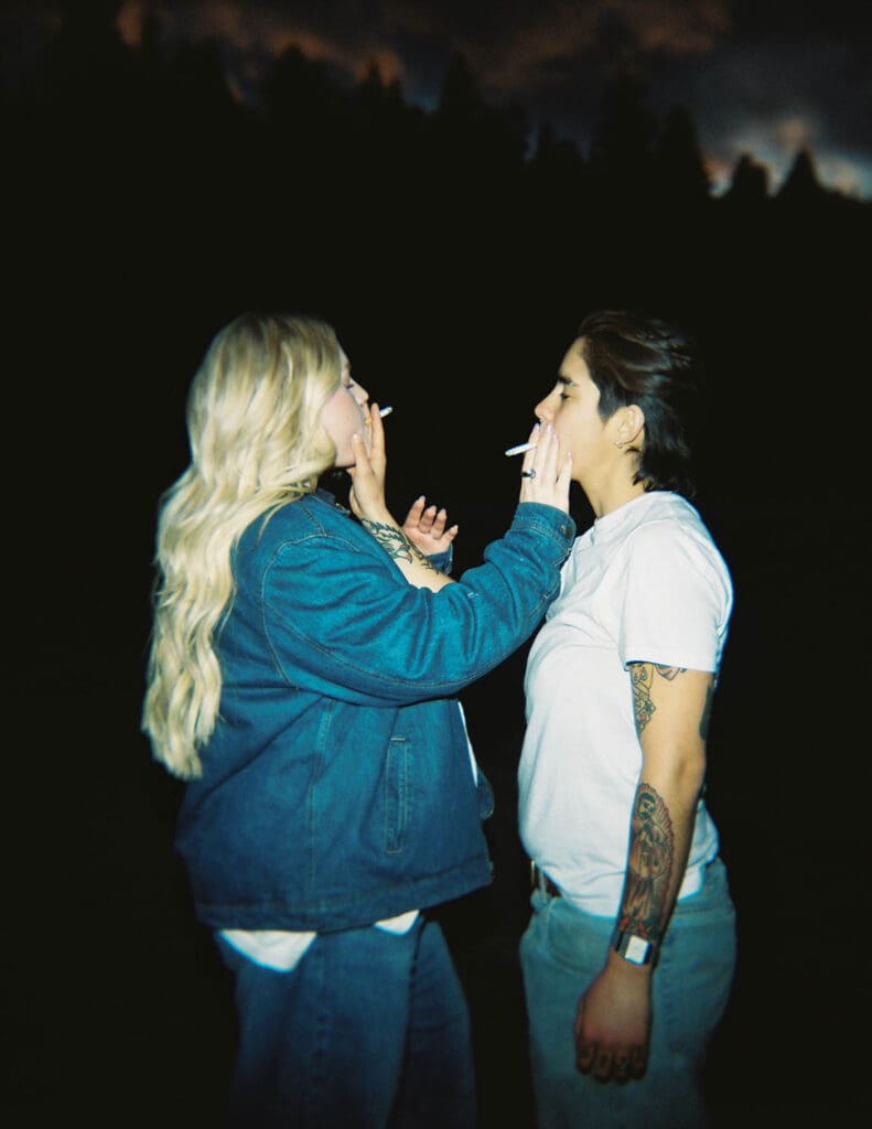 couple smoking a cigarette at their engagement session