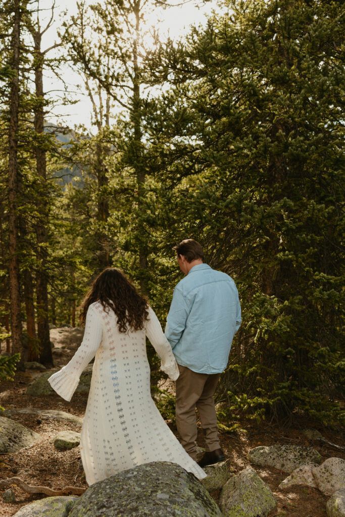 walking into the woods at echo lake park engagement session