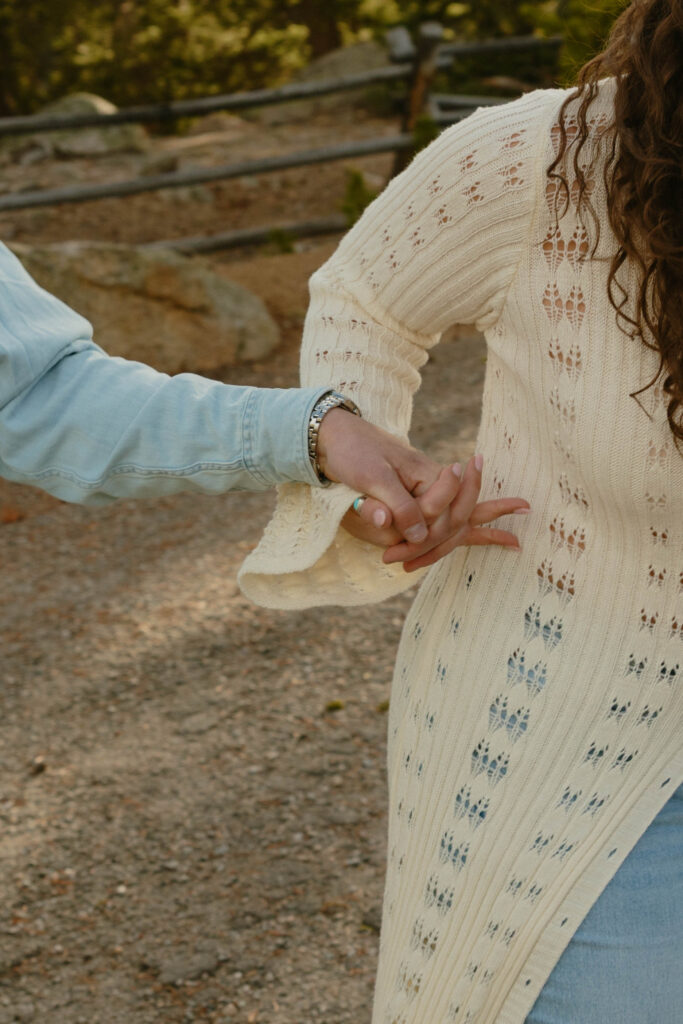 couple holding hands at engagement session