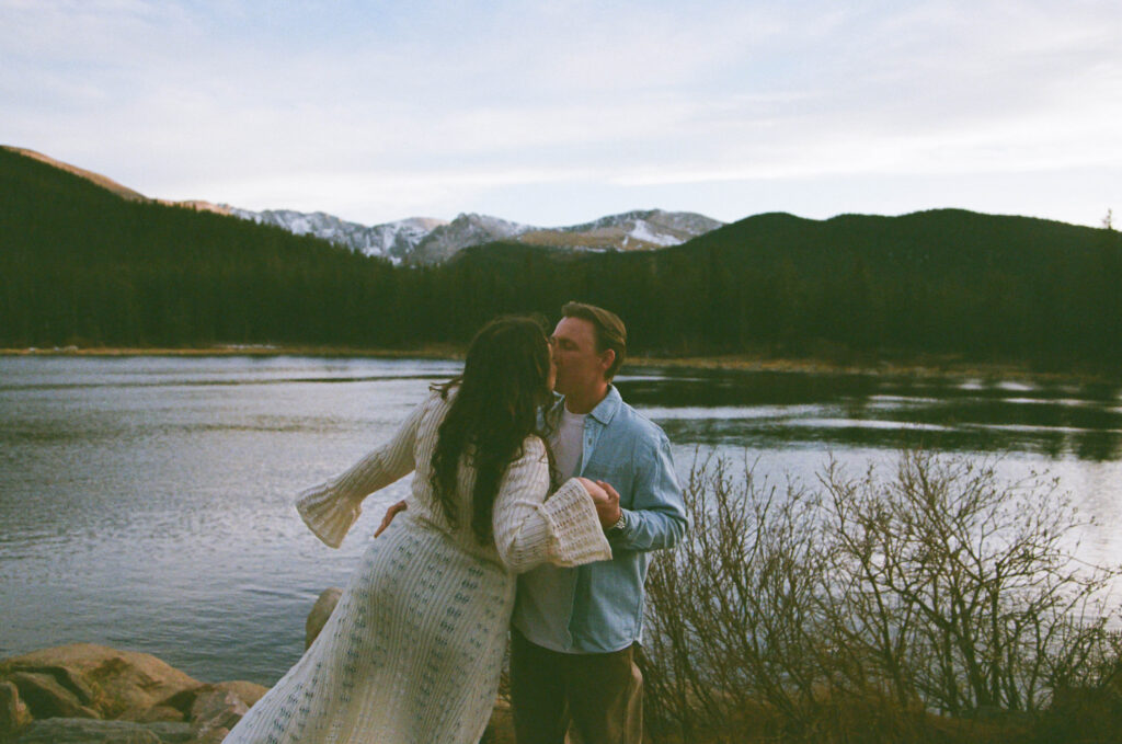 man and woman kissing during engagement session at echo lake park