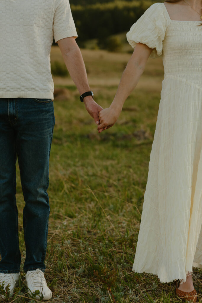 Playful engagement session in Colorado meadow