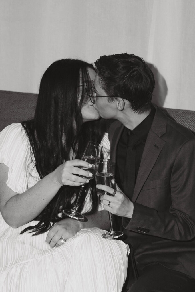 two brides sharing a kiss on their wedding day