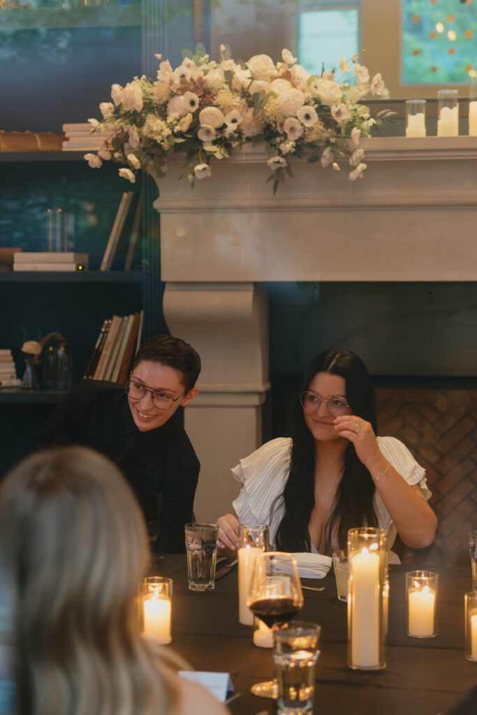 two brides on their wedding day during intimate family dinner