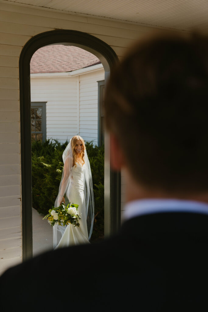 groom admiring his bride on wedding day