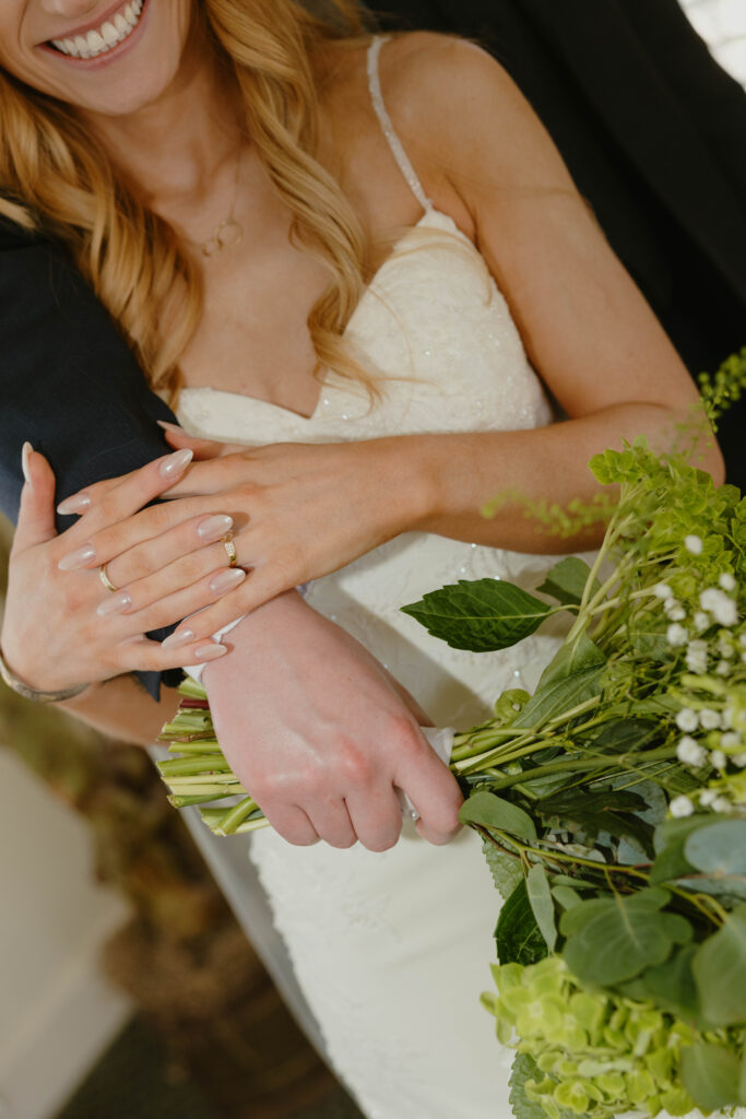 bride and groom hand details on wedding day