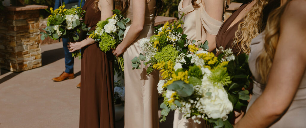 bride and bridesmaid floral details wedding day sneak peeks