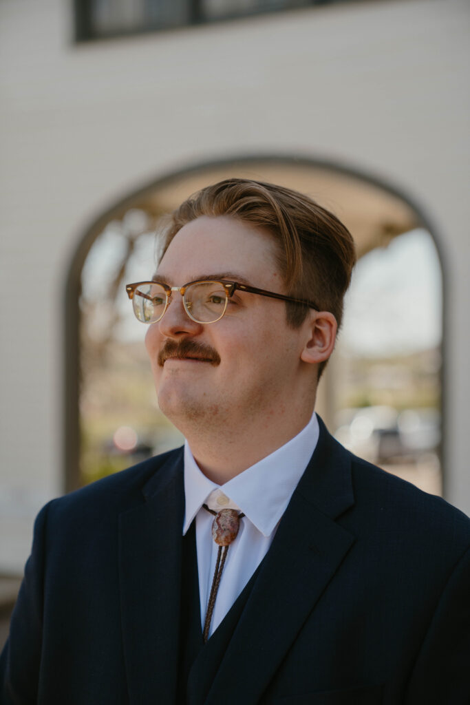 groom smiling on wedding day