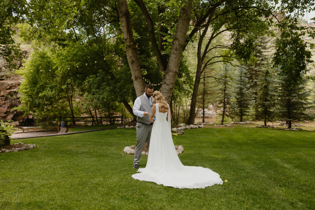 bride and groom first look at colorado wedding venue