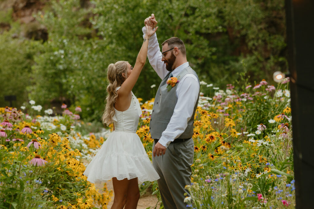 bride and groom portraits in a flower garden