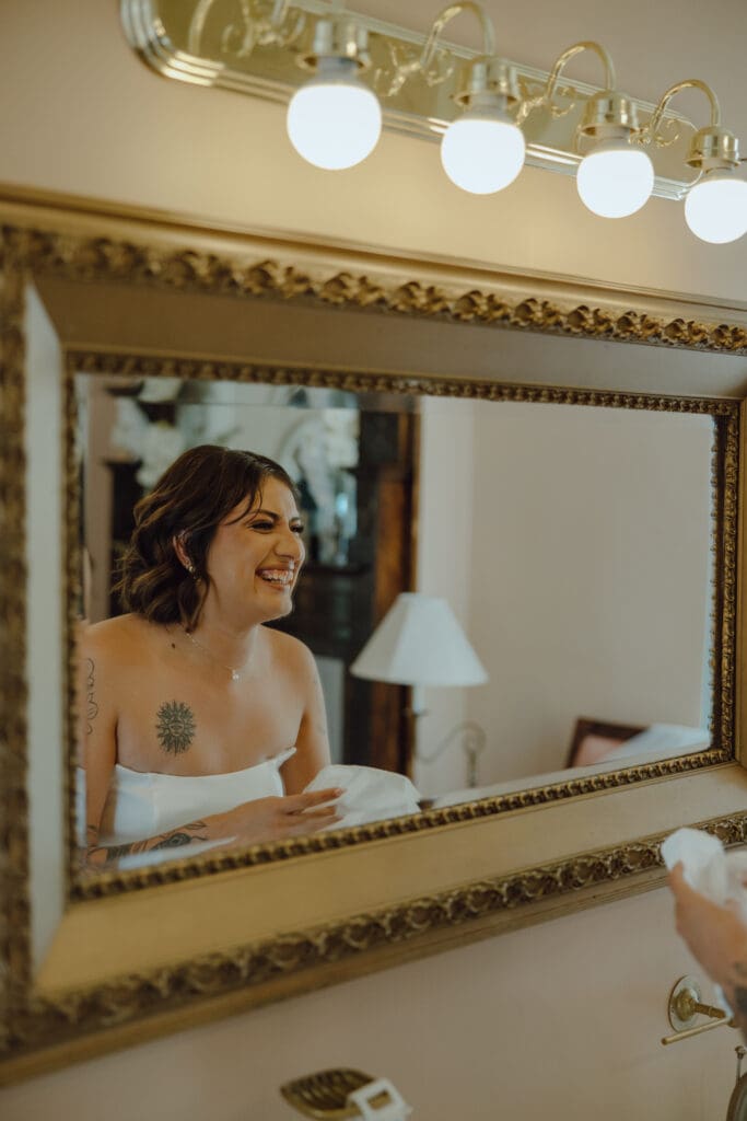 Bride looking in mirror 