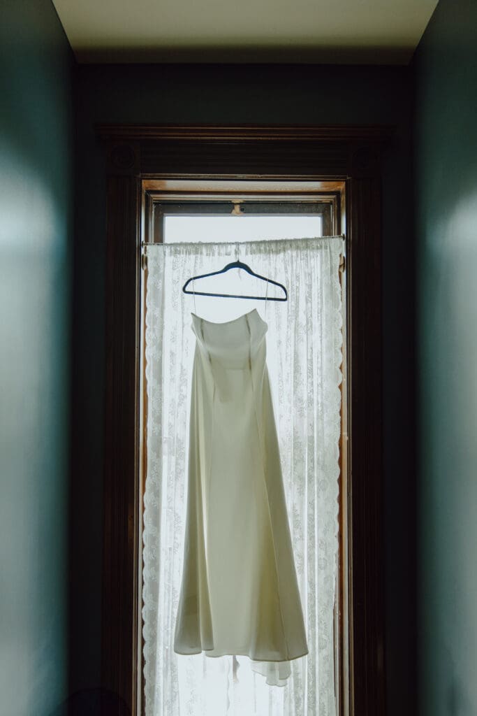 Colorado Wedding, Wedding dress hanging from window